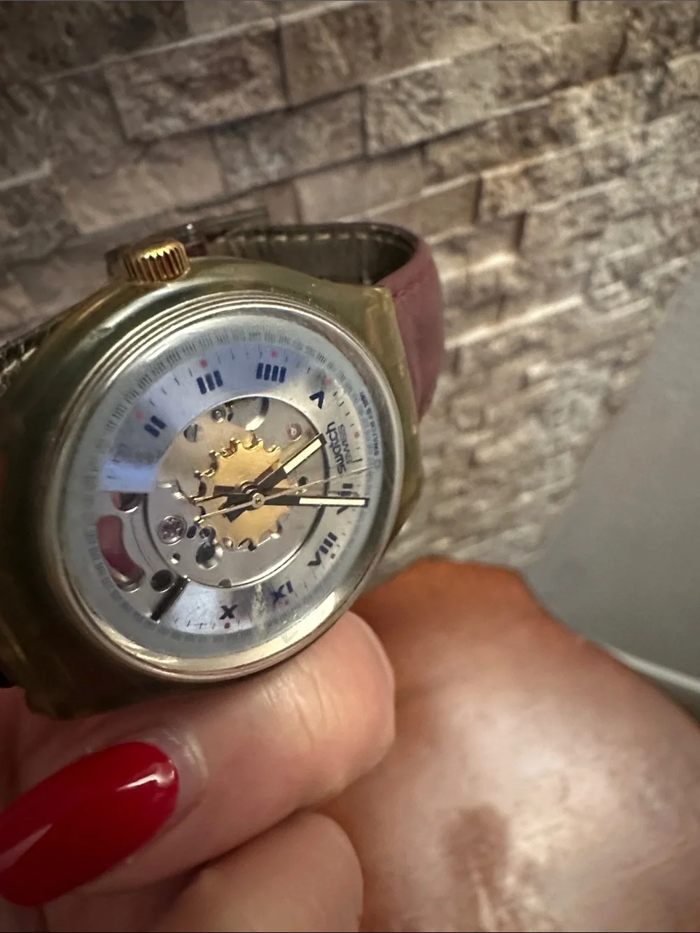 Swatch Gold and Blue Skeleton Dial Watch